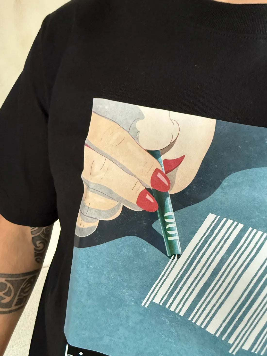 Close-up of the High on Capitalism print: a hand with red nails cutting lines from a barcode.